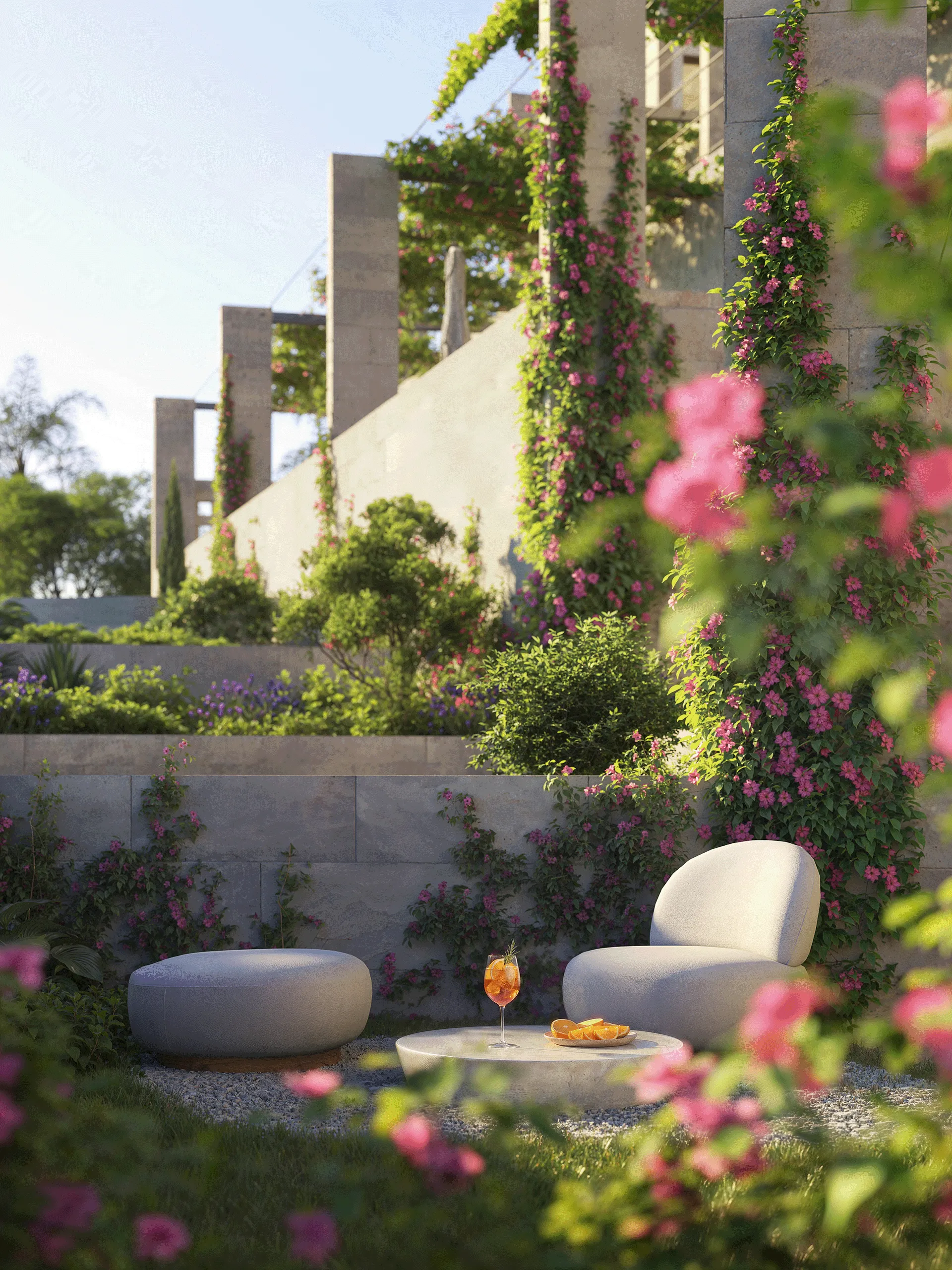 Outdoor seating with modern chair, ottoman, table, and orange drink in a garden with pink flowers.